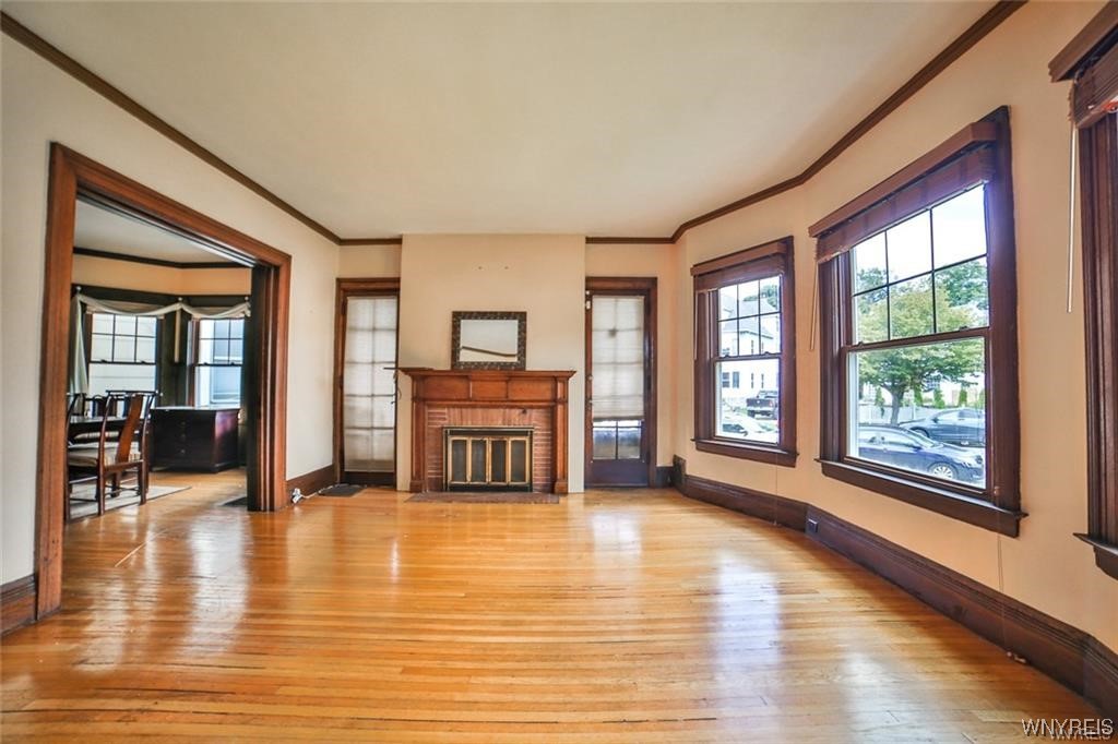 32 Colonial Circle Buffalo, NY 14213 - Photo 12 of 36 DOORS FLANKING FIREPLACE LEAD TO SIDE PORCH.