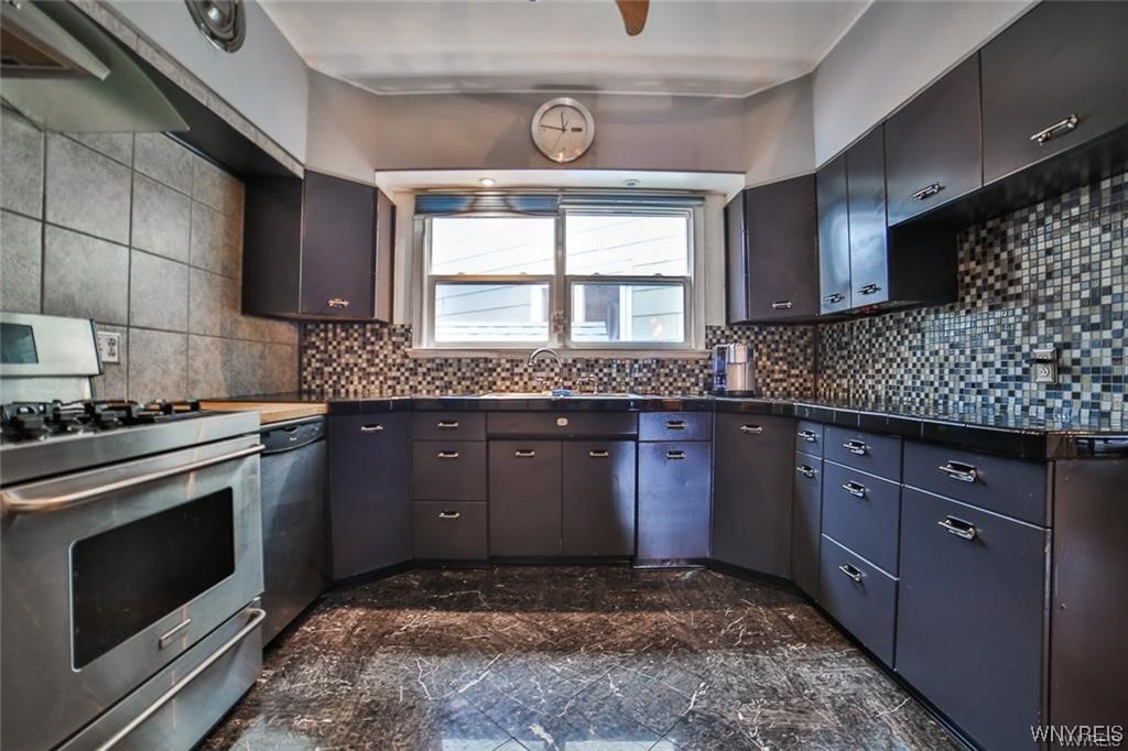 32 Colonial Circle Buffalo, NY 14213 - Photo 18 of 36 GENEROUSLY SIZED KITCHEN W/ AMPLE STORAGE.