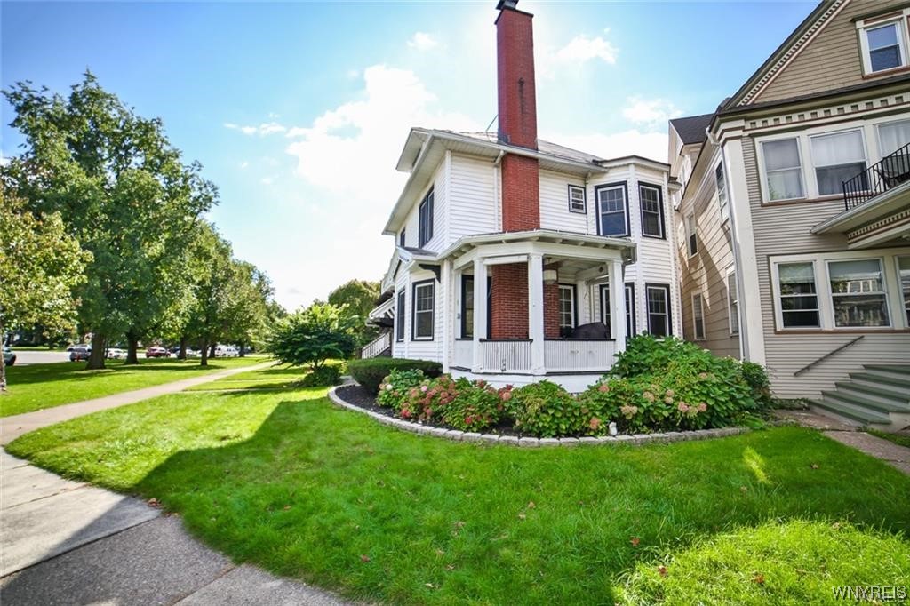 32 Colonial Circle Buffalo, NY 14213 - Photo 3 of 36 AMAZING SIDE PORCH OFF LIVING ROOM.