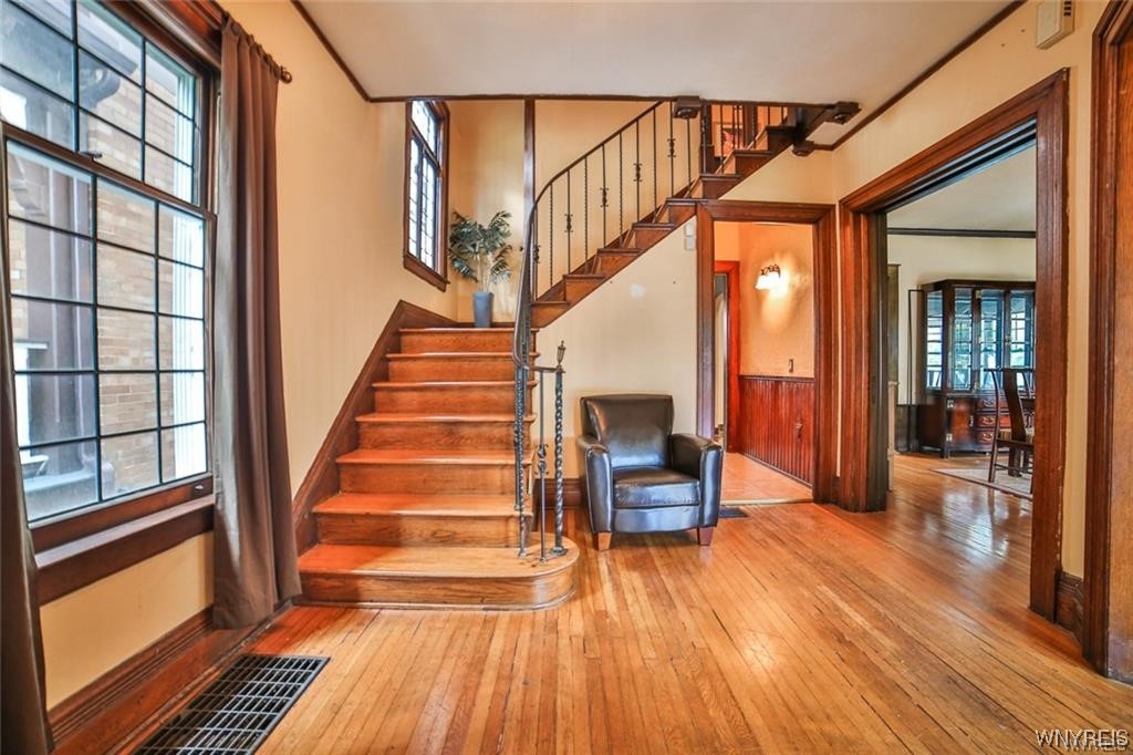 32 Colonial Circle Buffalo, NY 14213 - Photo 7 of 36 FOYER LEADING TO MAIN STAIRCASE W/ ORNATE FORGED M