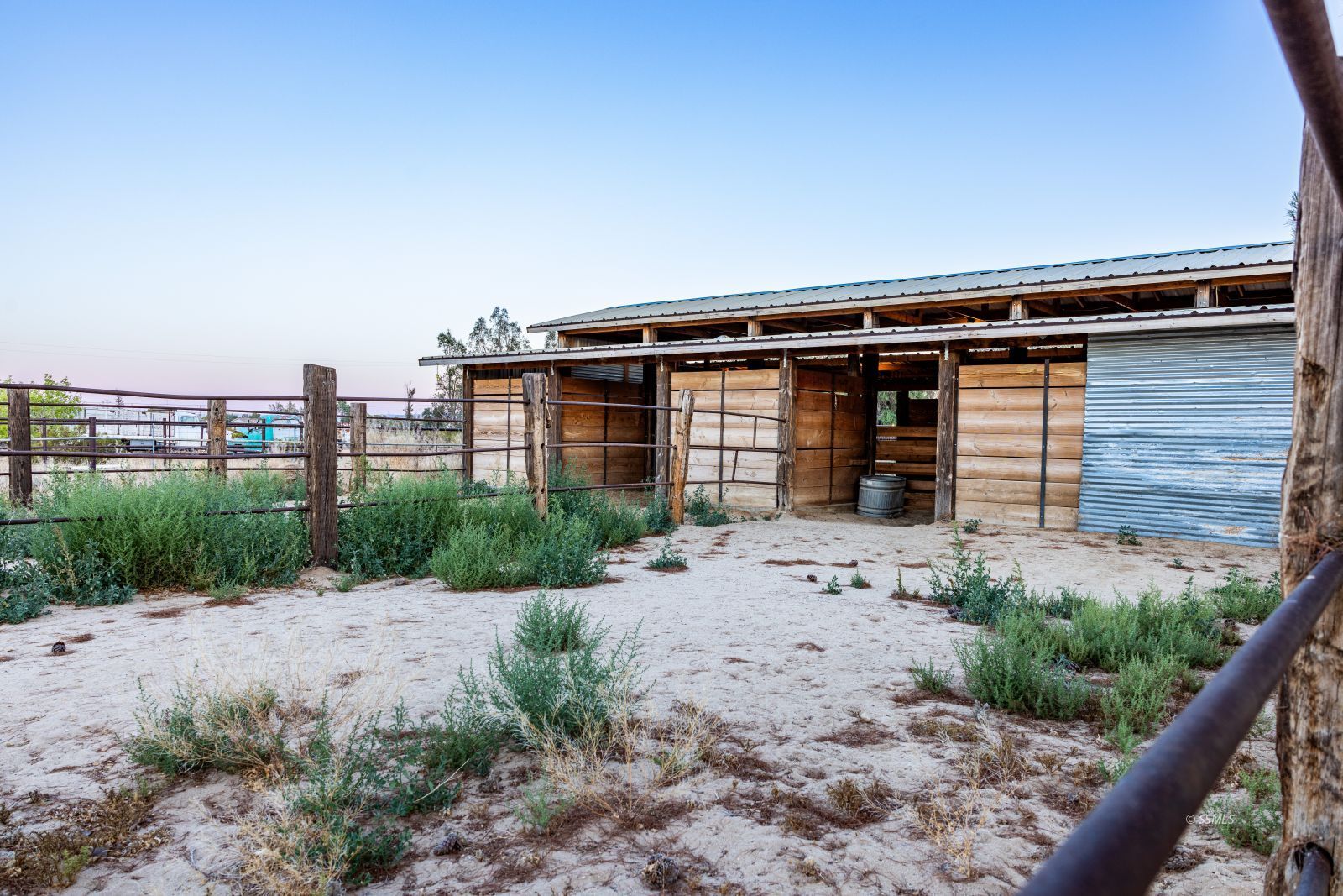 828 North Victor Street Ridgecrest, CA 93555 - Photo 43 of 50 a front view of a house with garden