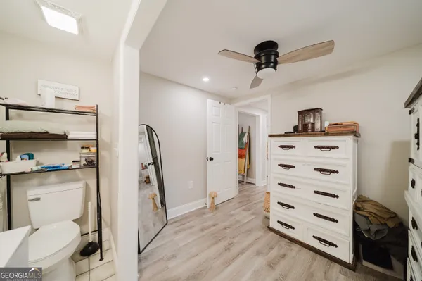a view of workspace with furniture and wooden floor