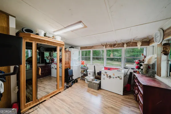 a view of a house with porch and wooden floor
