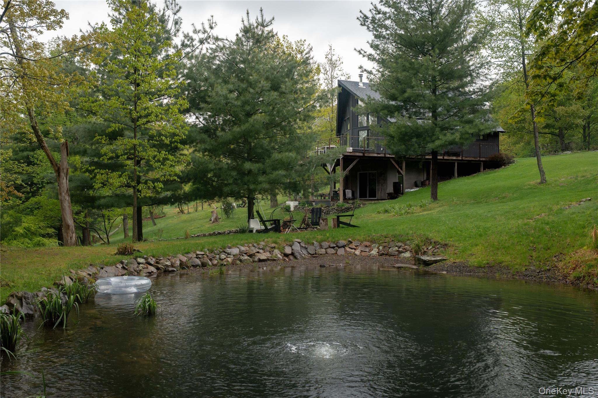 22 Mc Guffey Road Kerhonkson, NY 12446 - Photo 1 of 24 a view of a lake with houses