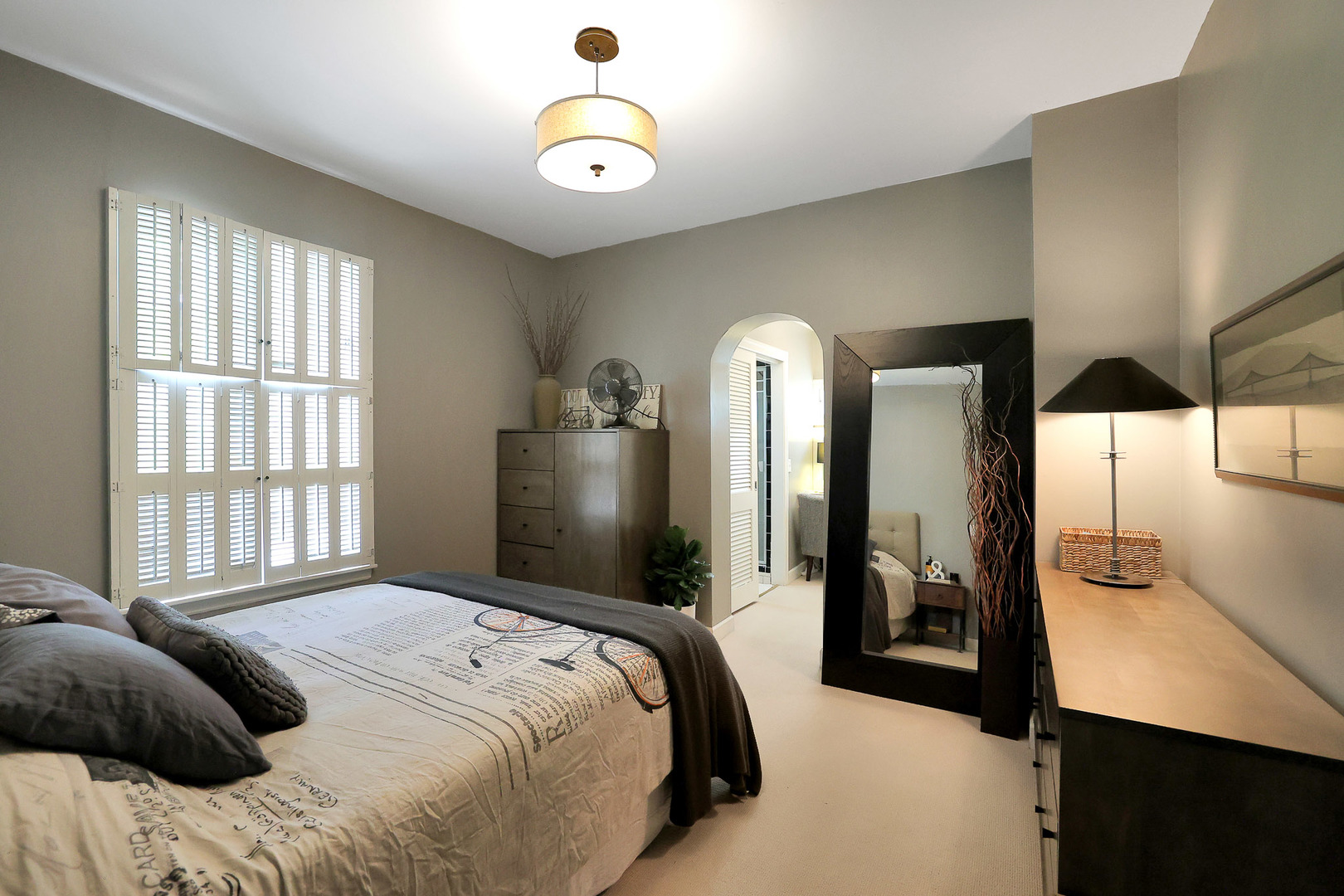 244 Indian Trail Lake In The Hills, IL 60156 - Photo 20 of 52 a bedroom with a large bed and a chandelier