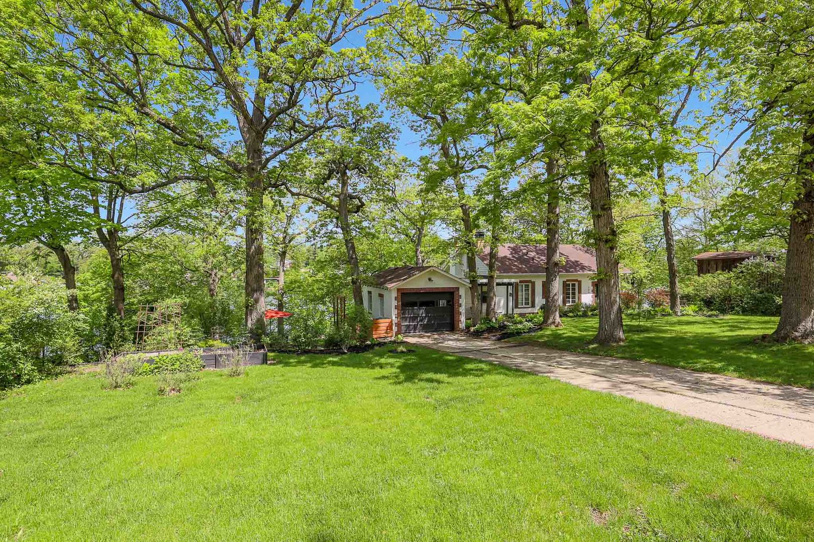 244 Indian Trail Lake In The Hills, IL 60156 - Photo 2 of 52 a view of a house with a yard and tree s