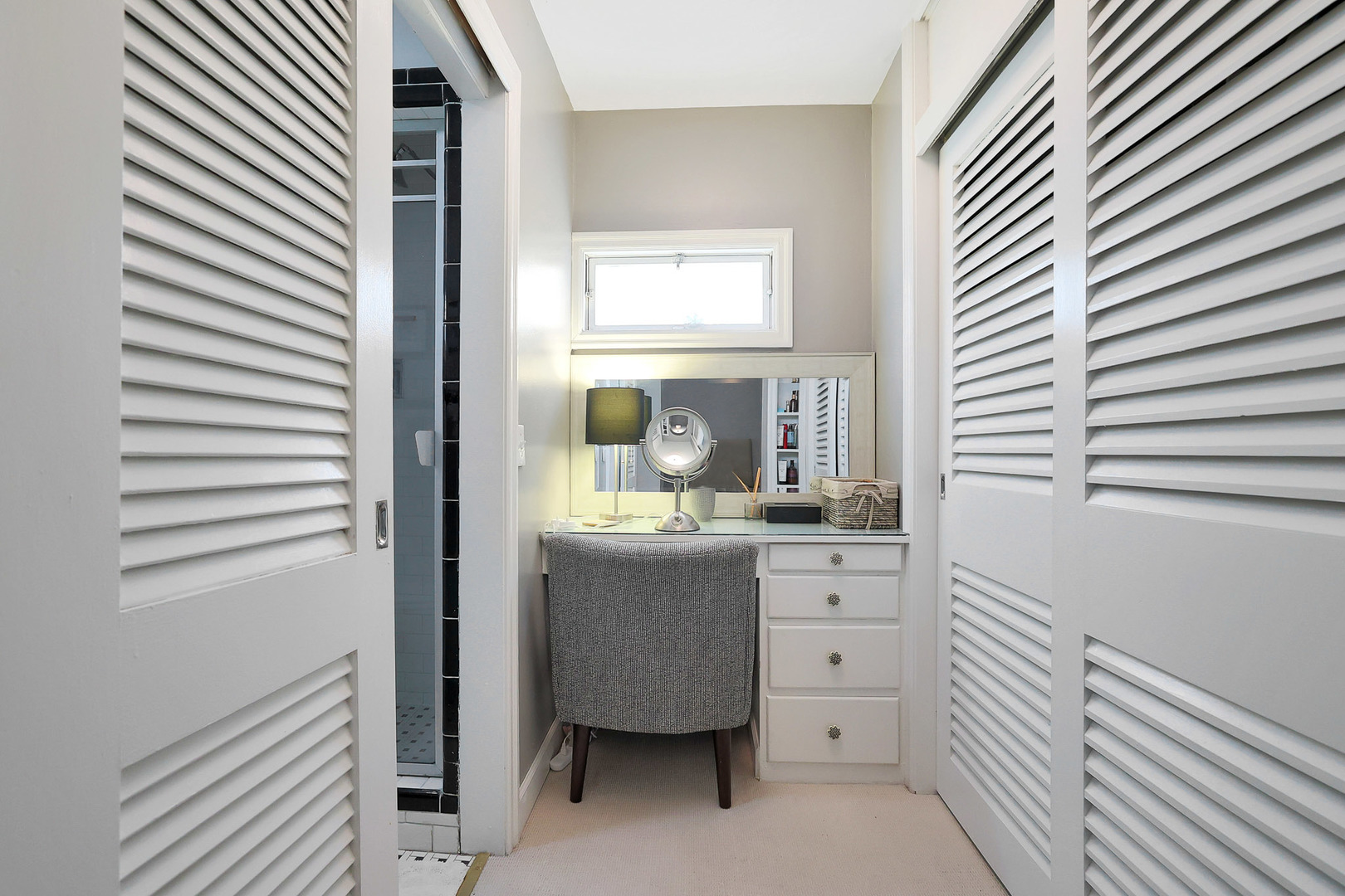 244 Indian Trail Lake In The Hills, IL 60156 - Photo 21 of 52 a bathroom with a sink a mirror and a window