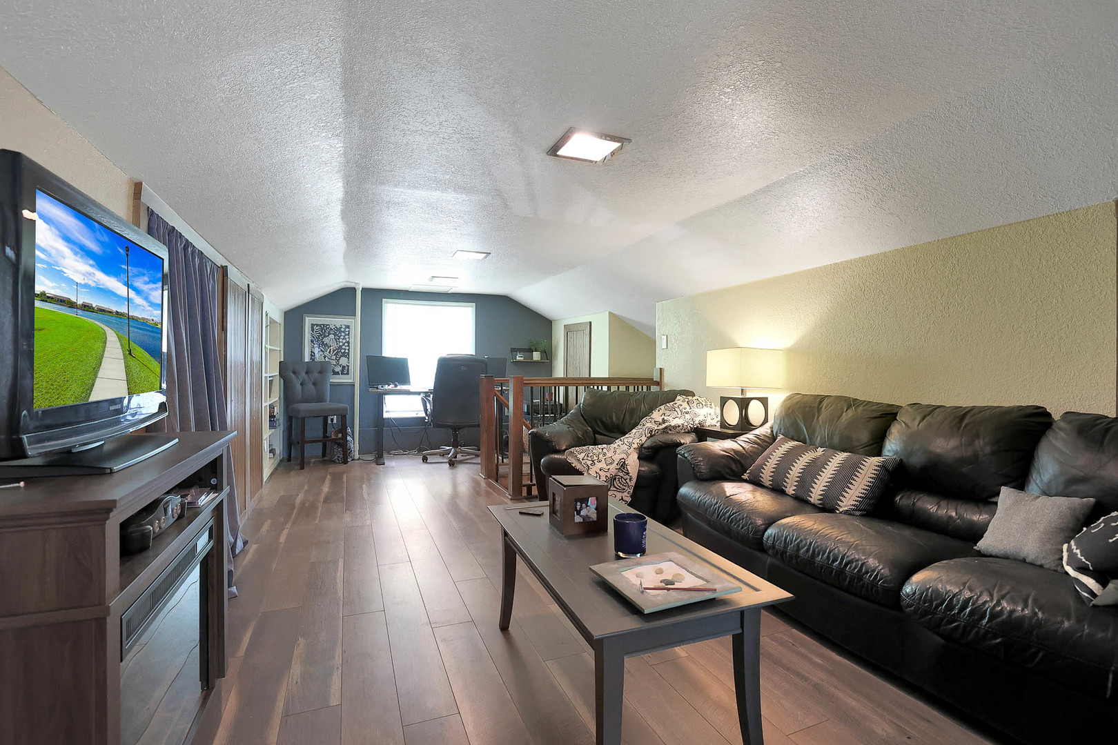 244 Indian Trail Lake In The Hills, IL 60156 - Photo 25 of 52 a living room with furniture a flat screen tv and wooden floor