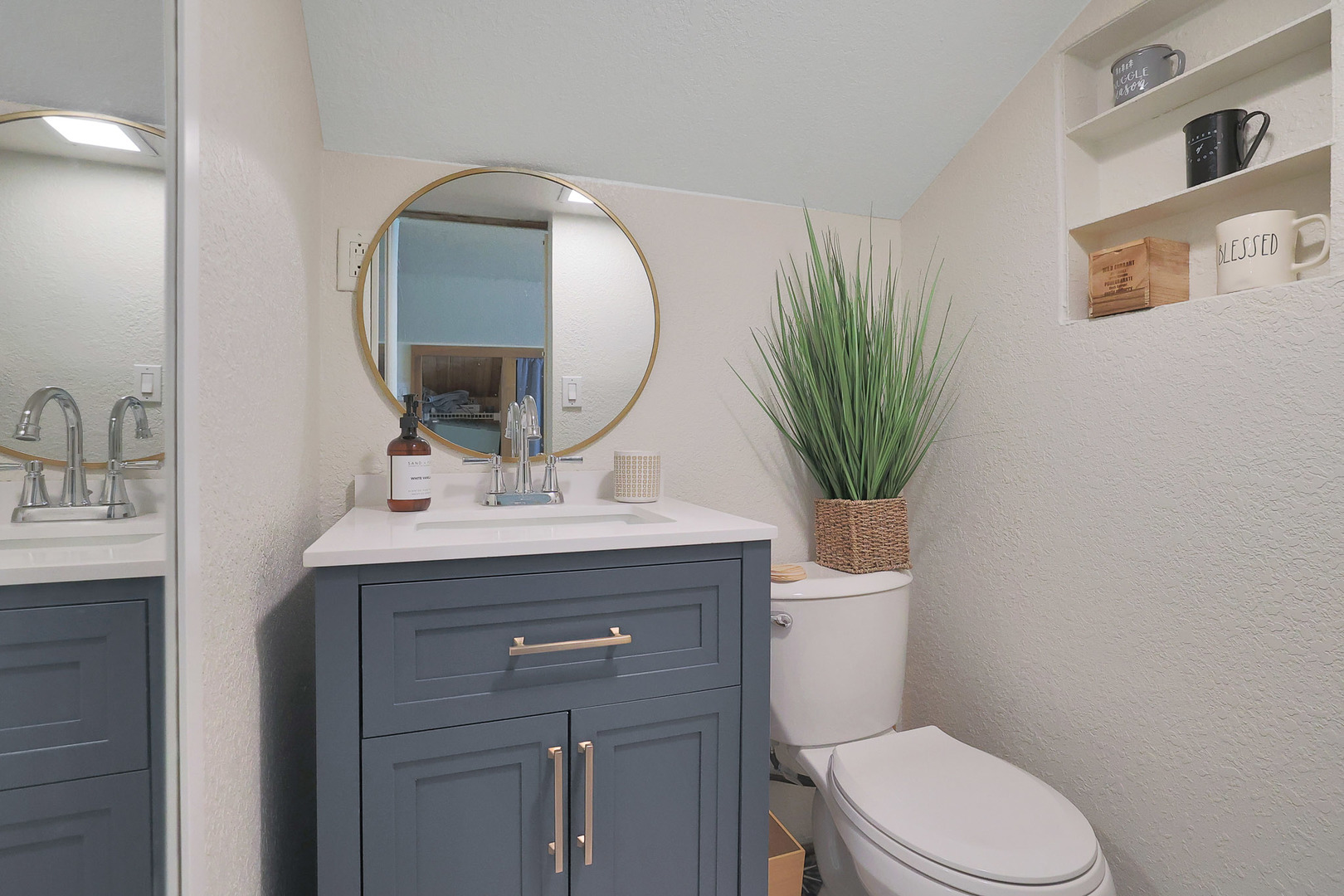 244 Indian Trail Lake In The Hills, IL 60156 - Photo 27 of 52 a bathroom with a toilet a sink and mirror