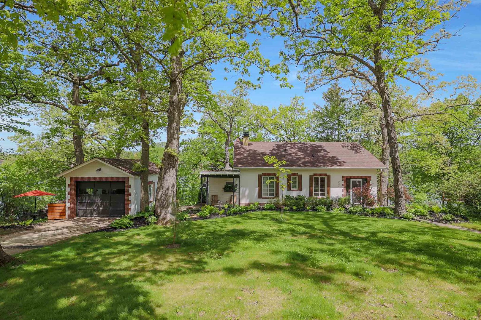 244 Indian Trail Lake In The Hills, IL 60156 - Photo 3 of 52 a front view of a house with a garden