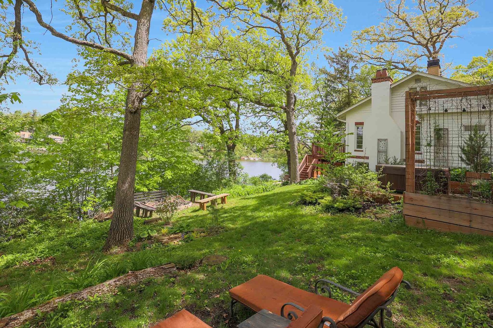 244 Indian Trail Lake In The Hills, IL 60156 - Photo 36 of 52 a backyard of a house with a garden and outdoor seating