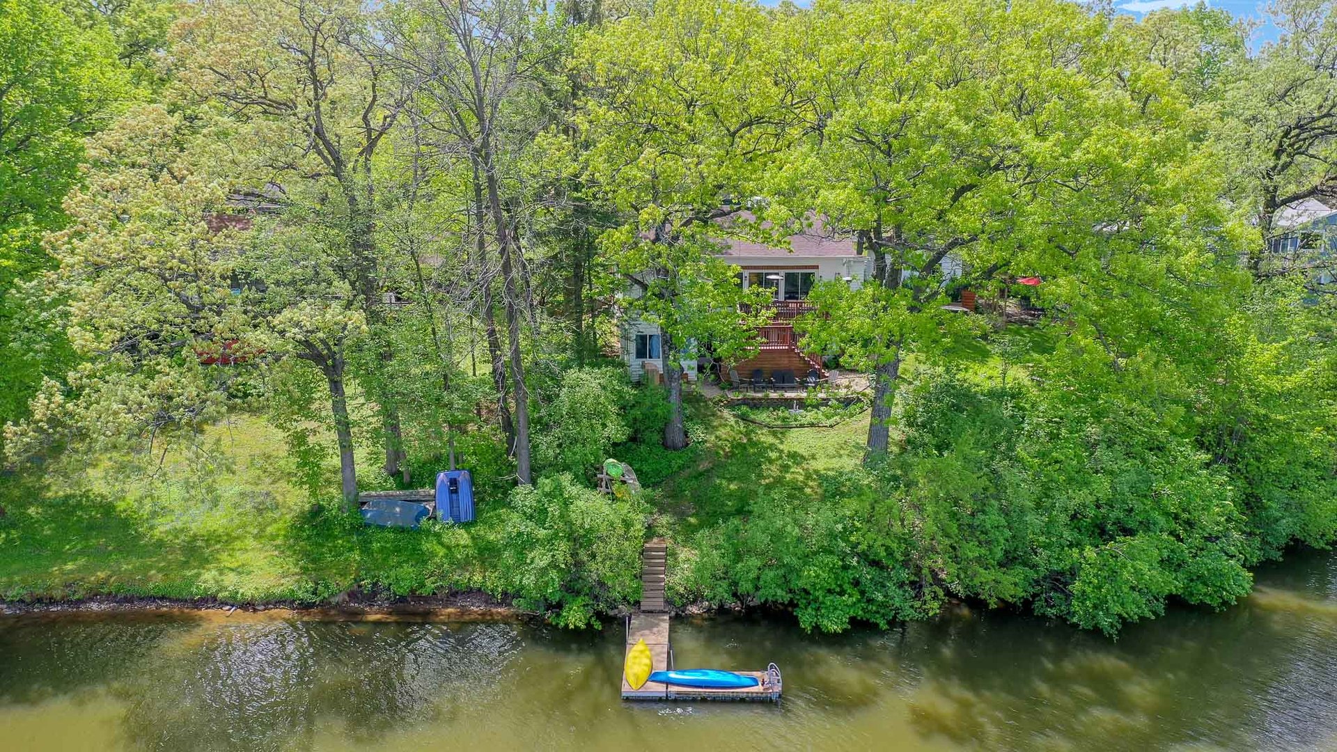 244 Indian Trail Lake In The Hills, IL 60156 - Photo 49 of 52 a view of a lake with a house in the background