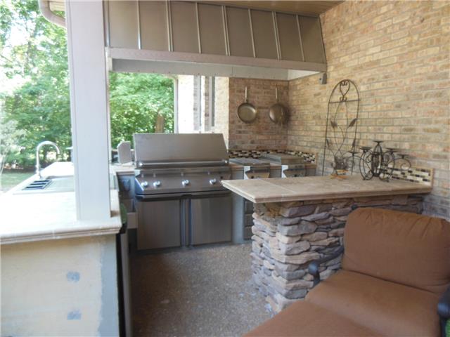 4168 Old Coopertown Road Springfield, TN 37172 - Photo 15 of 20 This outdoor kitchen has 2 burner cooktop, 48" grill, fridge, sink and lots of counter space. It's all you need and more.