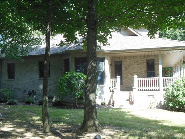 4168 Old Coopertown Road Springfield, TN 37172 - Photo 17 of 20 This side view of the house shows the bay window and the side of the wrap around porch with the swing. It also has a porch entrance.