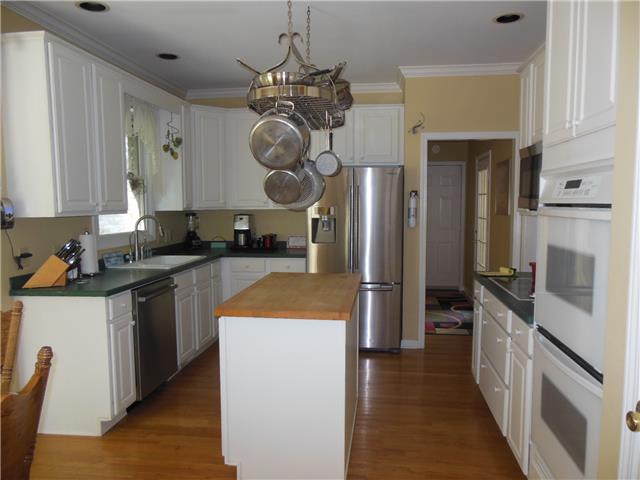 4168 Old Coopertown Road Springfield, TN 37172 - Photo 6 of 20 Large kitchen, corian countertops, cutting board island with upgraded hardware.