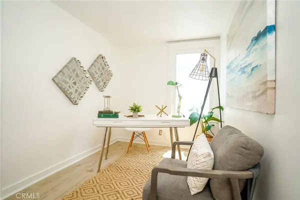 a workspace with furniture and window