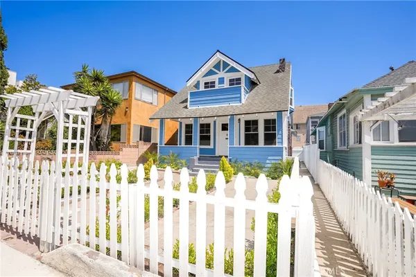 a front view of a house with a small yard