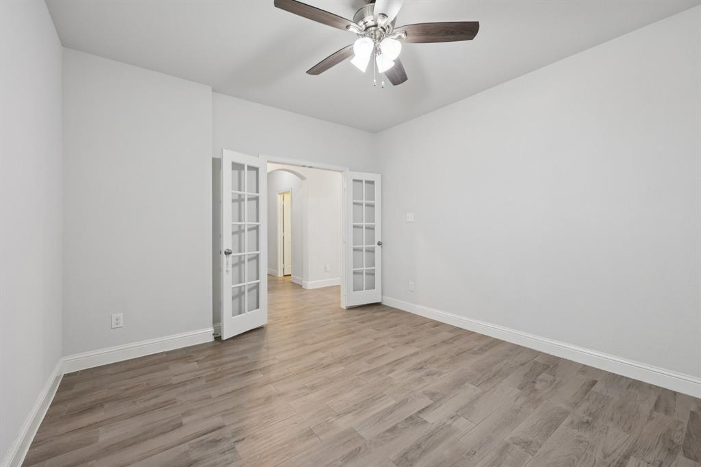 1205 Templin Avenue Forney, TX 75126 - Photo 12 of 40 a view of an empty room with wooden floor
