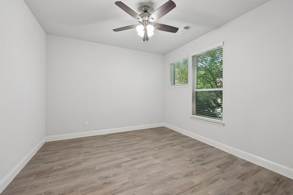 1205 Templin Avenue Forney, TX 75126 - Photo 13 of 40 wooden floor in an empty room with a window
