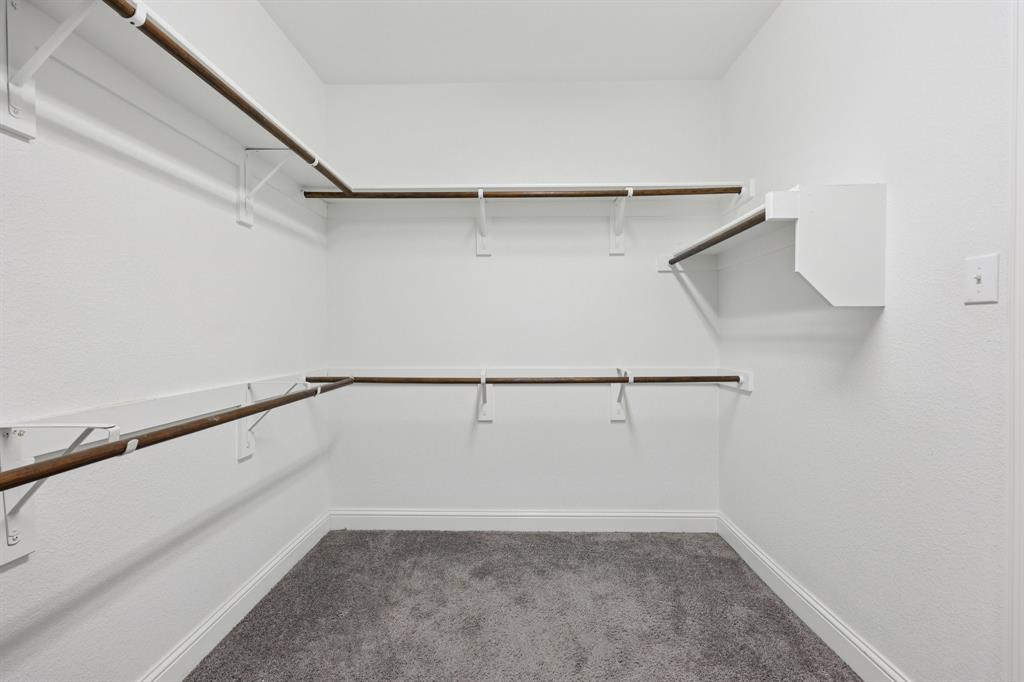 1205 Templin Avenue Forney, TX 75126 - Photo 22 of 40 a view of an empty walk in closet