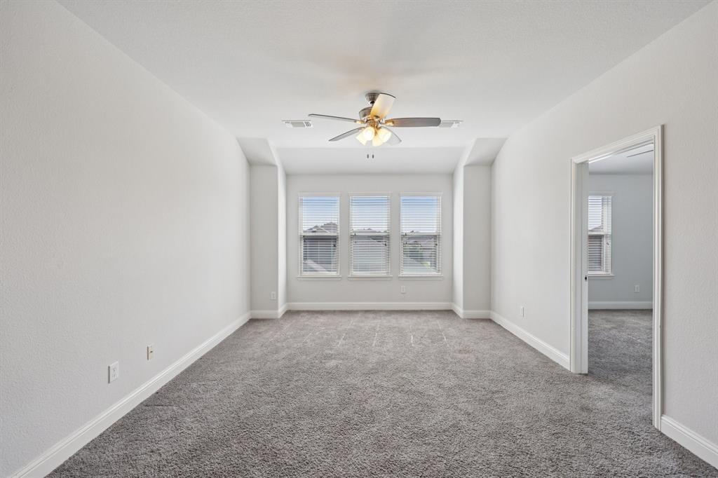 1205 Templin Avenue Forney, TX 75126 - Photo 28 of 40 a view of an empty room with a fireplace