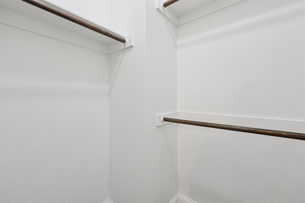 1205 Templin Avenue Forney, TX 75126 - Photo 35 of 40 a view of a room with shelf on the wall