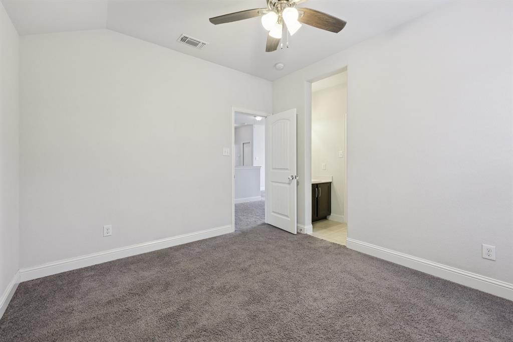 1205 Templin Avenue Forney, TX 75126 - Photo 37 of 40 an empty room with a empty space and a ceiling fan