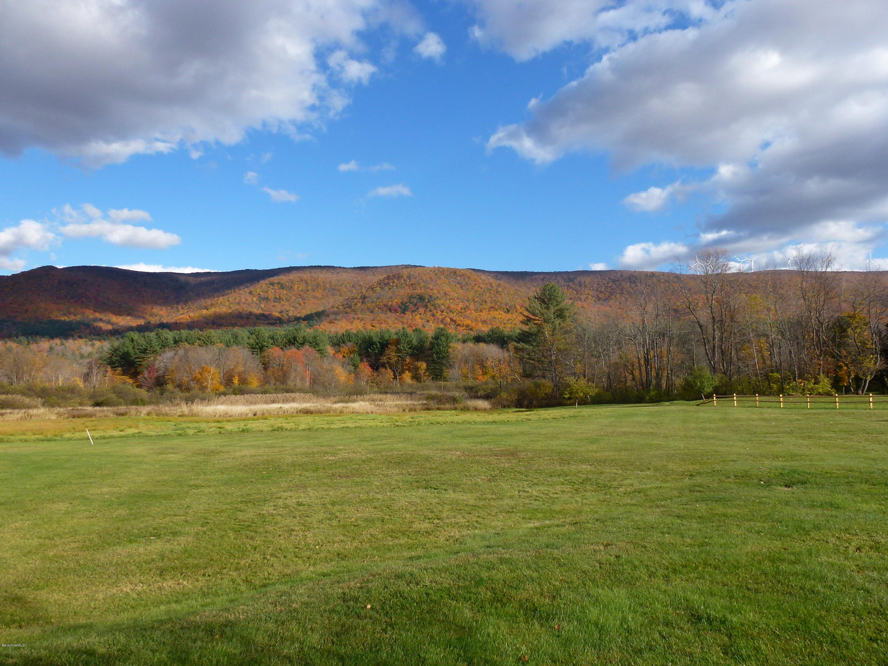 1254 Main Road Stamford, VT 05352 - Photo 11 of 39 a view of an ocean and a yard