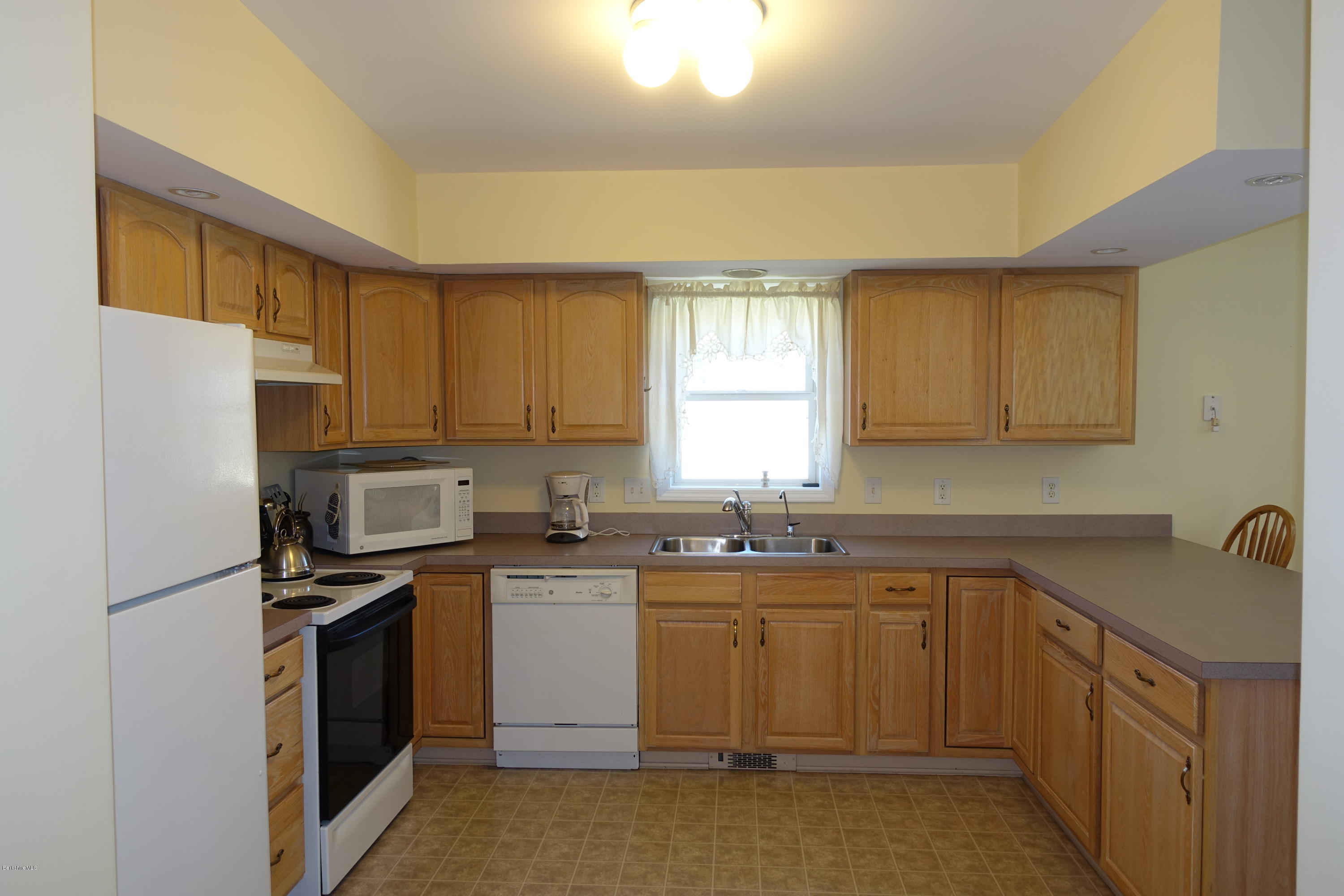 1254 Main Road Stamford, VT 05352 - Photo 20 of 39 a kitchen with a sink stove and refrigerator