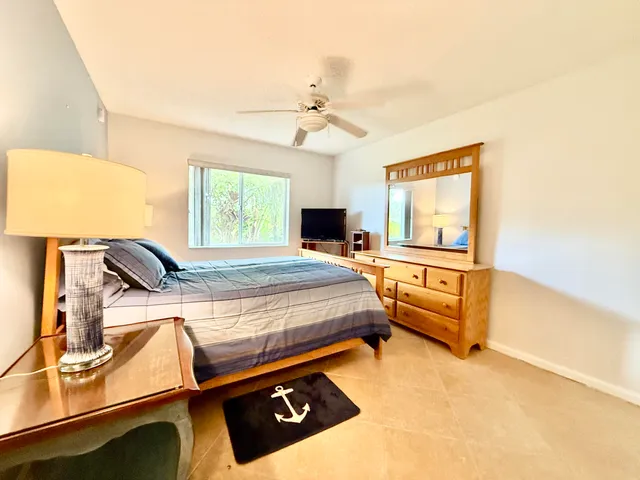 a bed room with a bed and a night stand