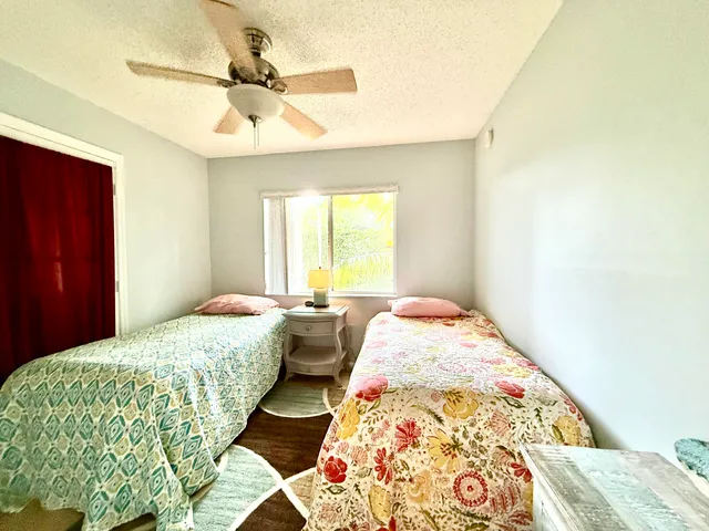 a bedroom with bed and window