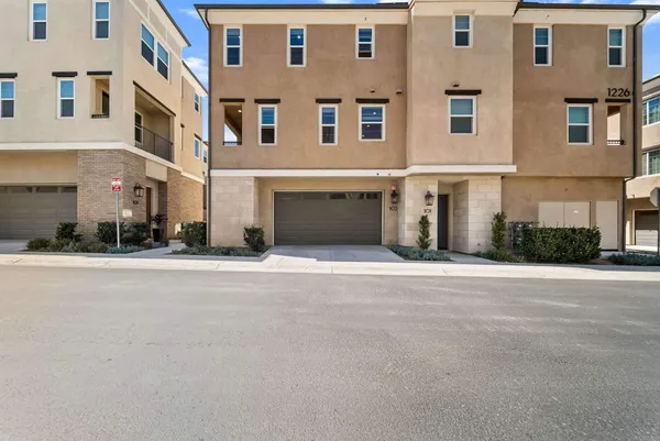 a front view of a building with a road