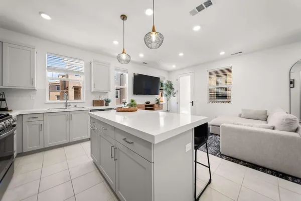 a kitchen with a sink stainless steel appliances and cabinets