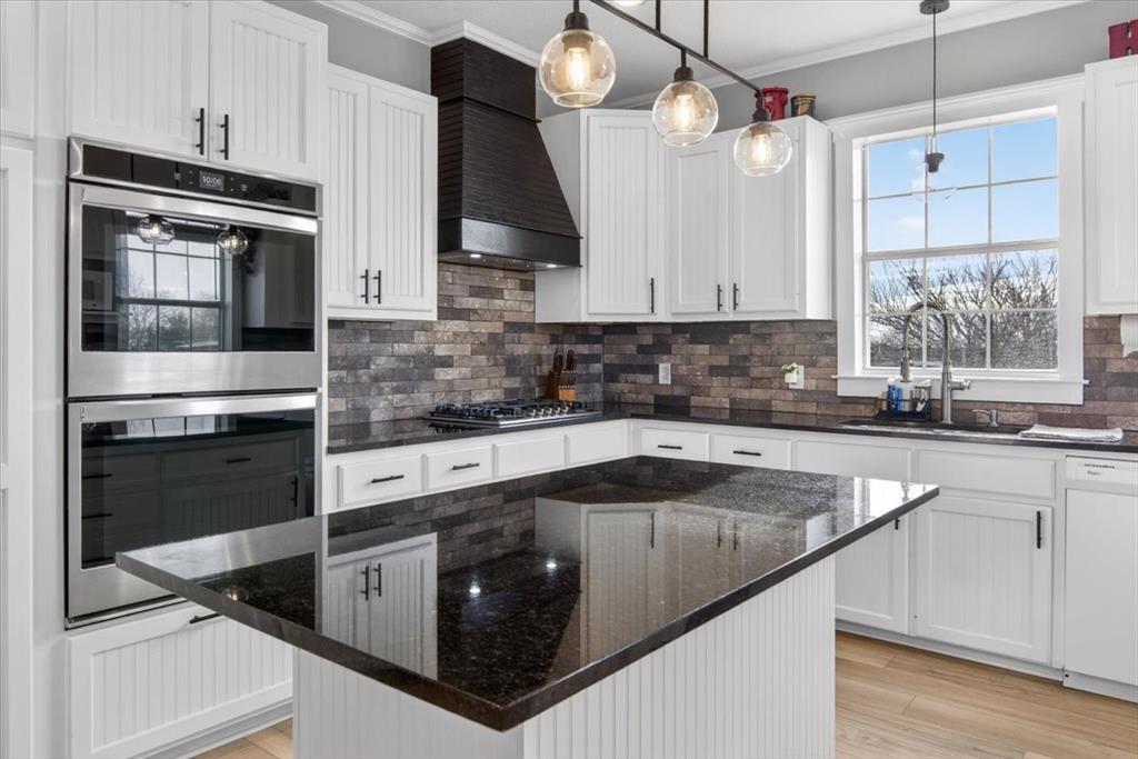 278 Leuschner Road Elm Mott, TX 76640 - Photo 14 of 31 a kitchen with stainless steel appliances granite countertop a sink a stove and a refrigerator