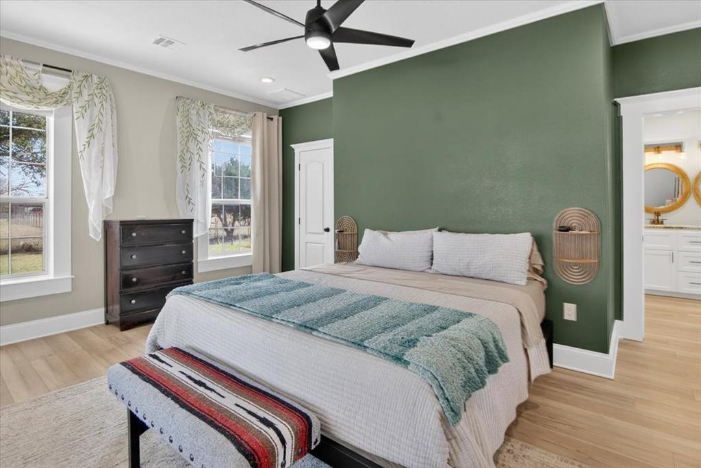 278 Leuschner Road Elm Mott, TX 76640 - Photo 20 of 31 a bedroom with a bed and wooden floor