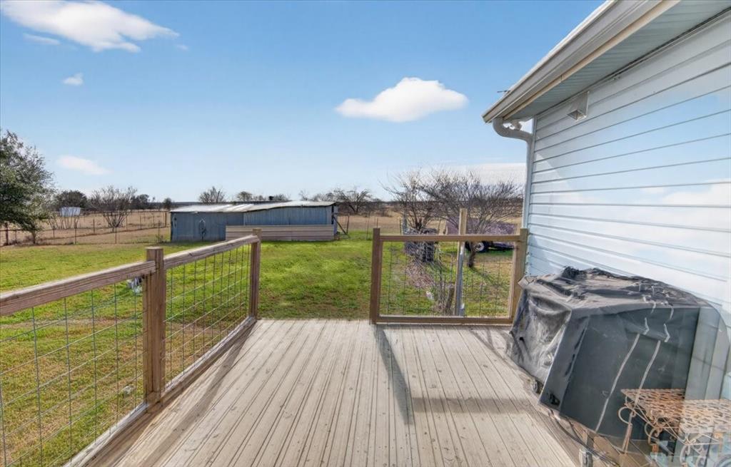 278 Leuschner Road Elm Mott, TX 76640 - Photo 25 of 31 a view of a balcony with wooden floor