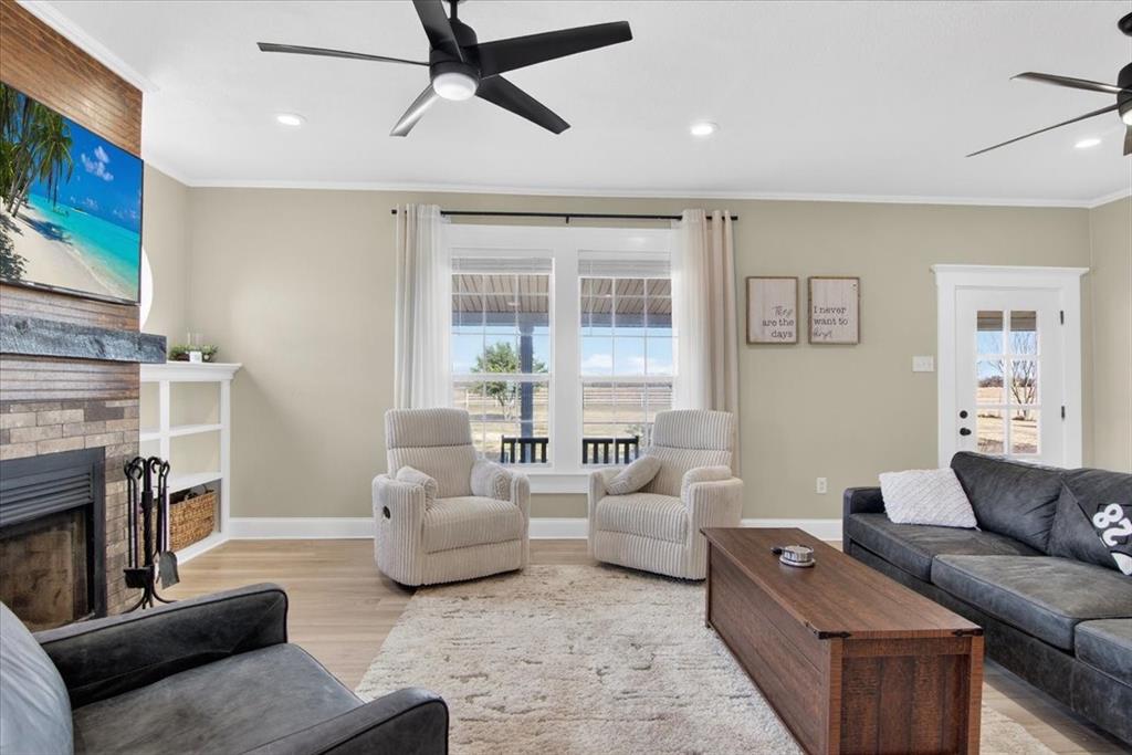278 Leuschner Road Elm Mott, TX 76640 - Photo 8 of 31 a living room with furniture and a flat screen tv