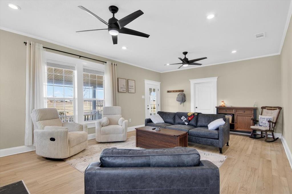 278 Leuschner Road Elm Mott, TX 76640 - Photo 9 of 31 a living room with furniture and a large window