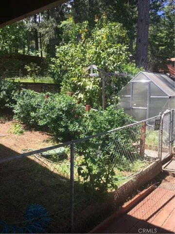 a view of a yard from a balcony