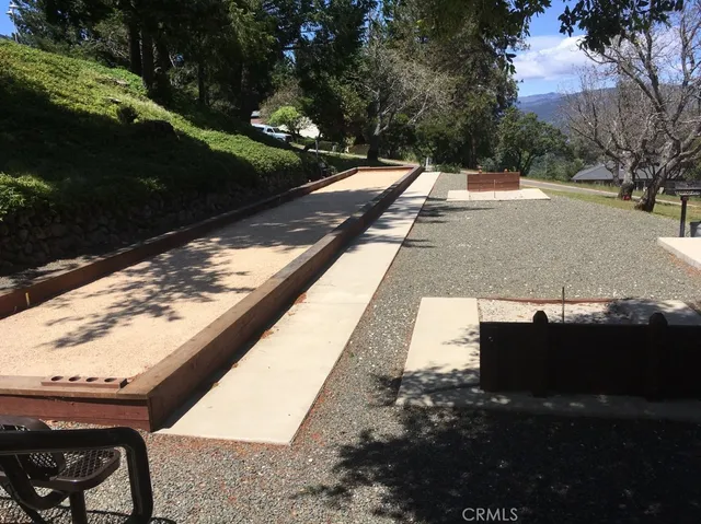 a view of a balcony with yard