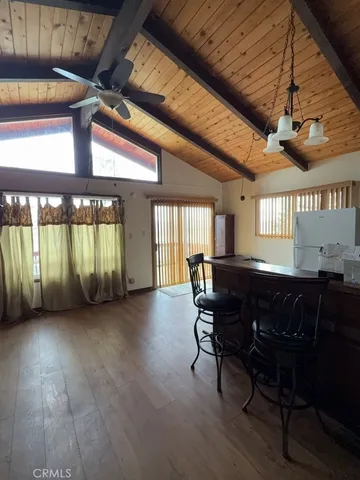 a view of a livingroom with furniture and window