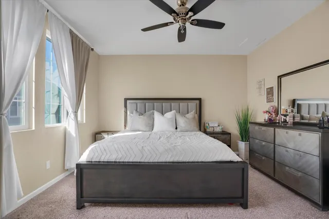 a bedroom with a bed and window