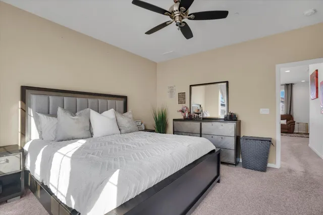 a bedroom with a bed and a mirror