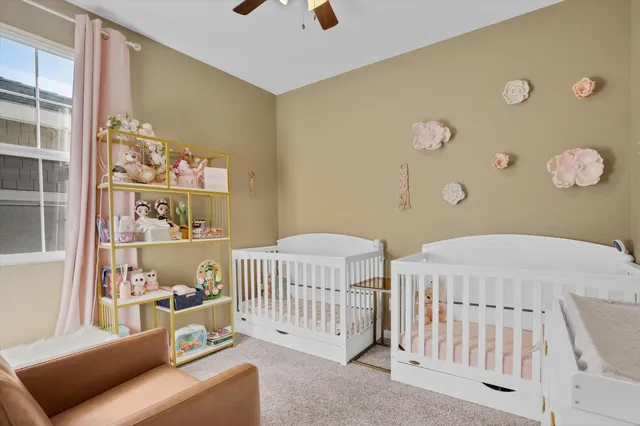 a bedroom with furniture and a window