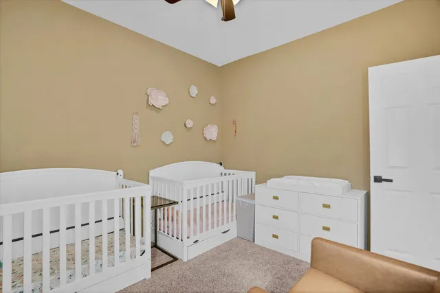 a bedroom with a bed and cabinets