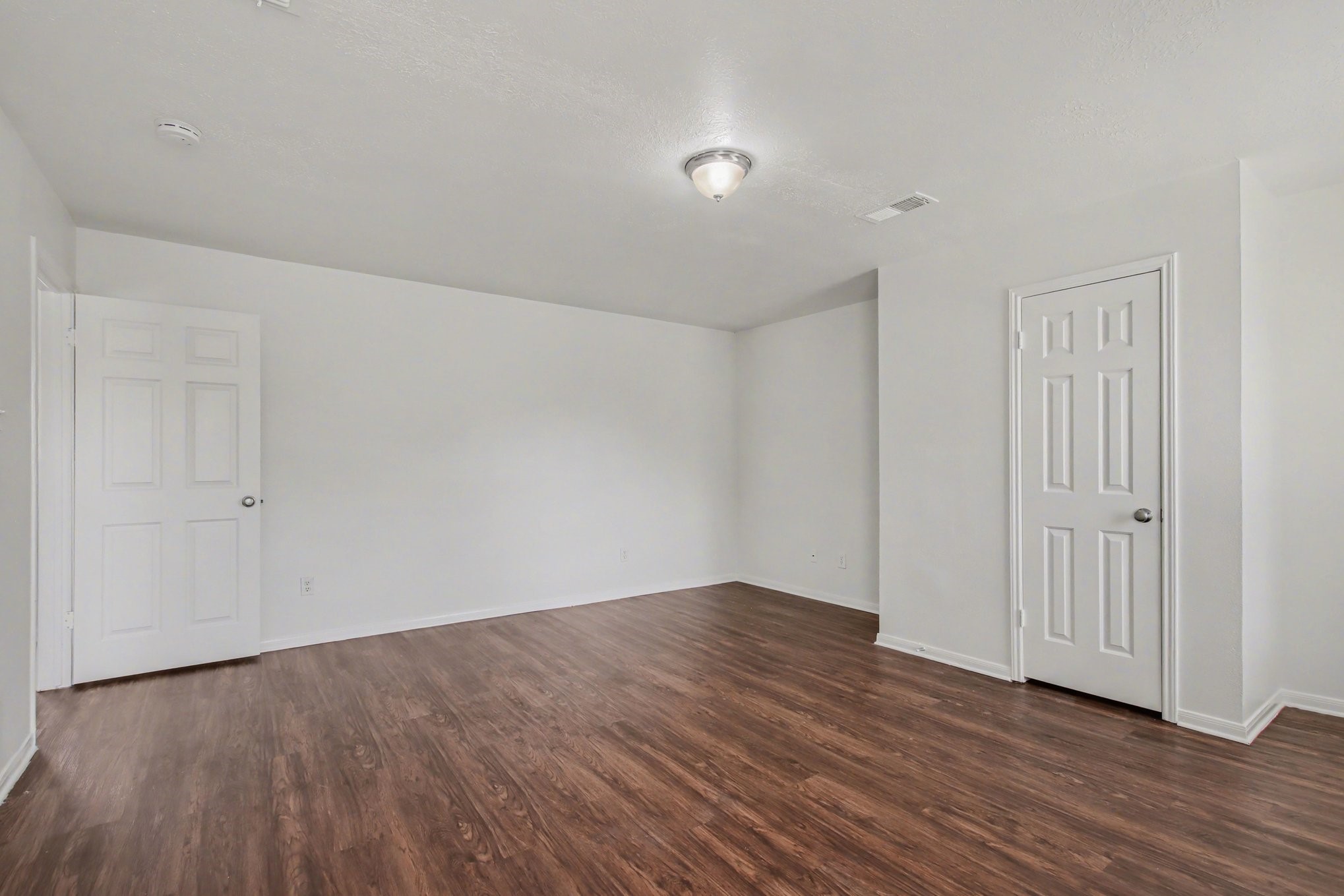 7203 Glen Rosa Drive Katy, TX 77494 - Photo 12 of 28 a view of an empty room with wooden floor