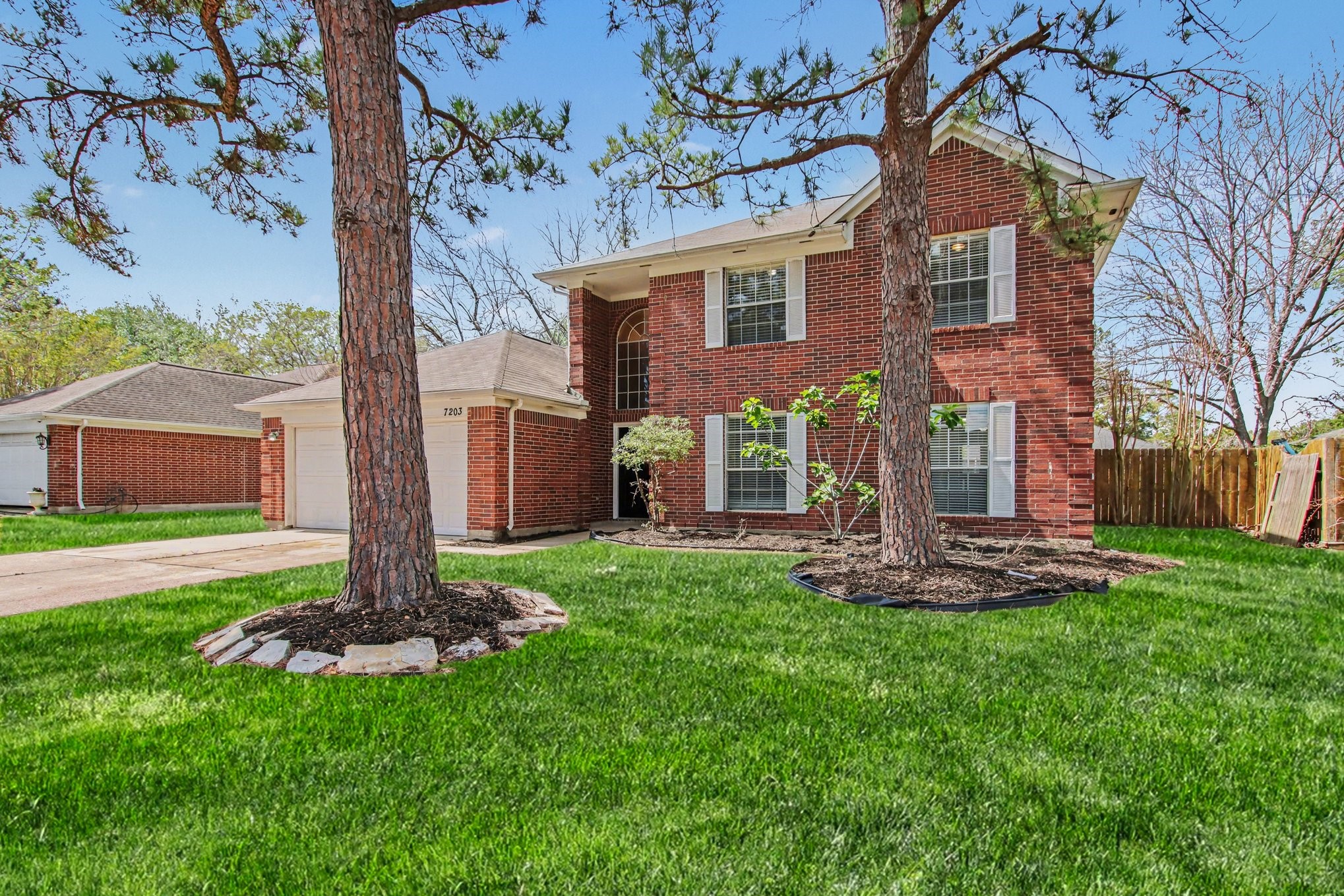 7203 Glen Rosa Drive Katy, TX 77494 - Photo 2 of 28 a front view of a house with a garden