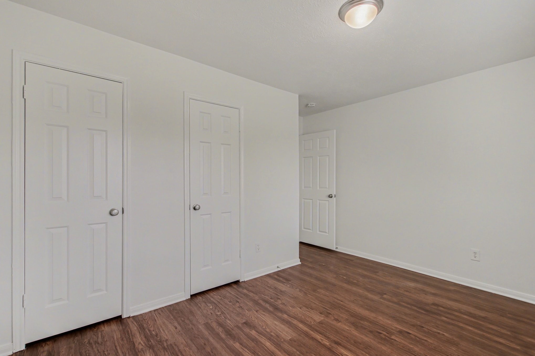 7203 Glen Rosa Drive Katy, TX 77494 - Photo 22 of 28 a view of an empty room with wooden floor