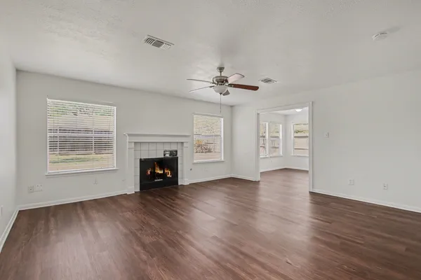 a kitchen with sink cabinets and wooden floor