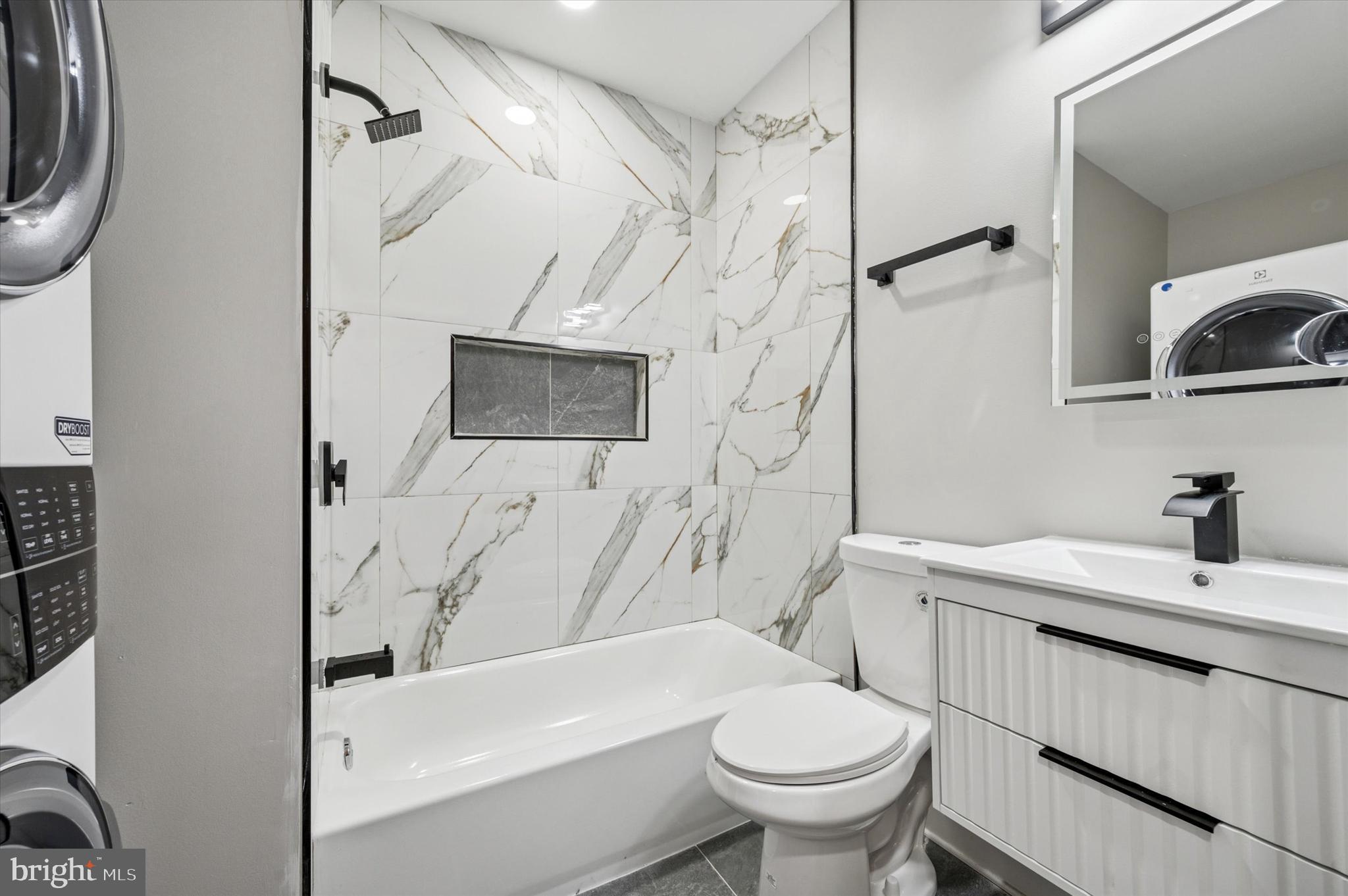 2917 North 7th Street, Unit 2 Philadelphia, PA 19133 - Photo 7 of 7 a bathroom with a sink a toilet and shower